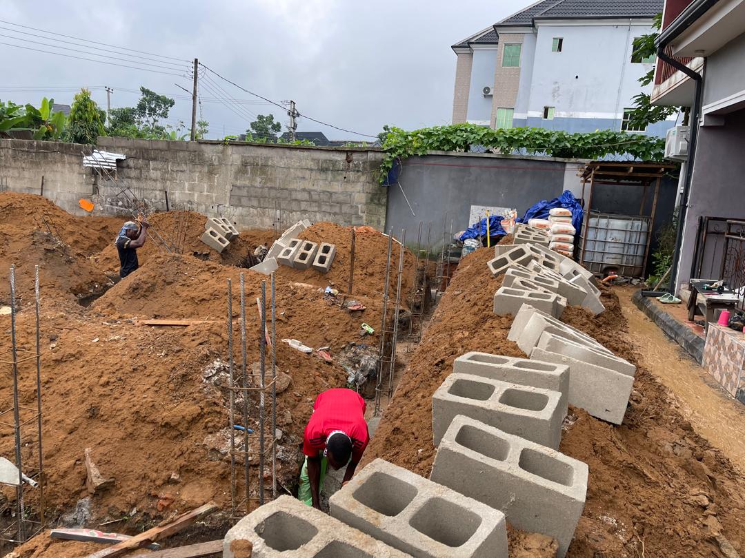 Foundation rebar and blockwork being executed on a construction site.